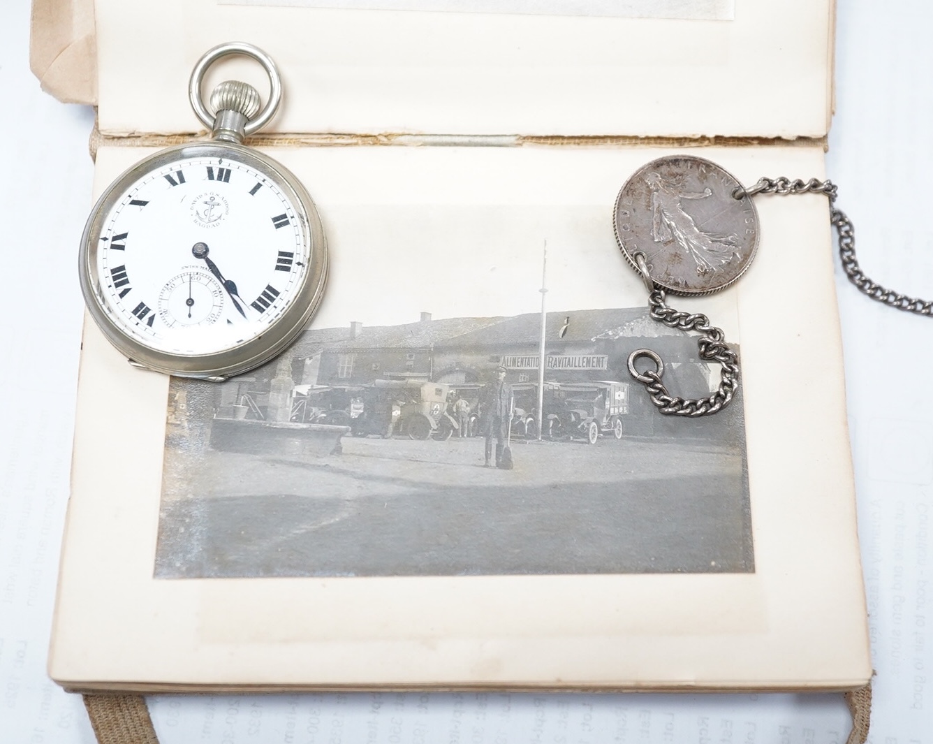 A WWI Ambulance and Balloon Brigade photograph album, pocket watch, coin, etc. Condition - fair, pocket watch ticks when wound